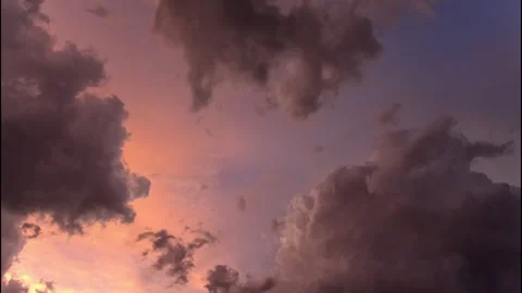 Time lapse of a building thunderstorm with colorful sunset clouds Stock Footage 340534974