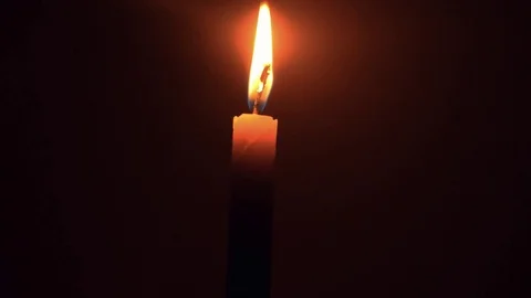 Time lapse to burning candle yellow light Video stock 80399874