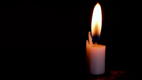 Time lapse Burning White Candle on the dark, flame of candle on black background Stock Footage 259429582