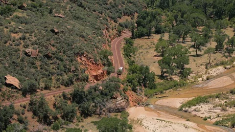 Time-lapse of bus going through bus stop in desert Stock Footage 128777390