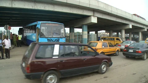 Time lapse, bus pulls out into heavy traffic, Shot from across road. Stock Footage 38478266