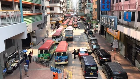 Time Lapse of Bus Traffic on Busy Street in Mong Kok - Daytime Stock Footage 87240928