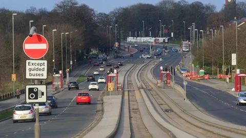 Time lapse buses using guided bus lane in the city of leeds uk Stock Footage 88616170