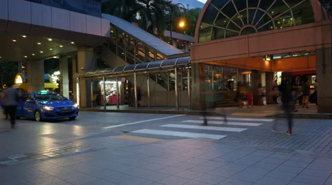 Time lapse of bustling crowds crossing the road, using escalator, taxi and publi Stock Footage 38177267