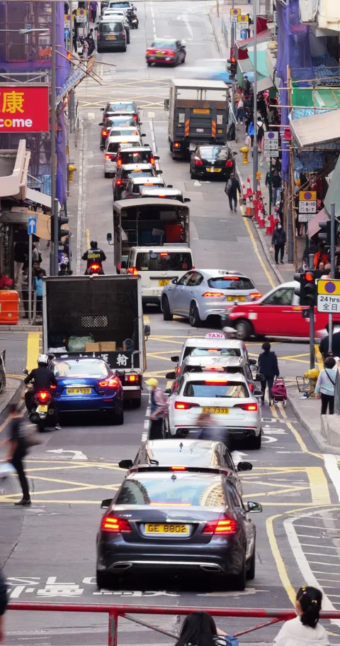 Time-lapse of bustling traffic flowing on Hong Kong Island street grid Stock Footage 309363454