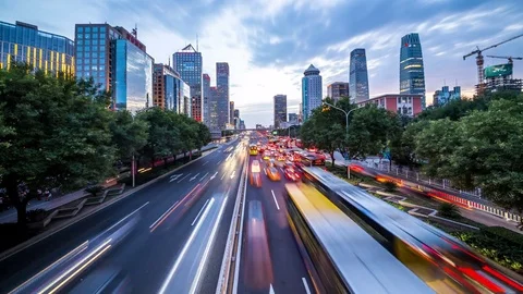 Time lapse of busy freeway traffic from day to night in beijing city，china Stock Footage