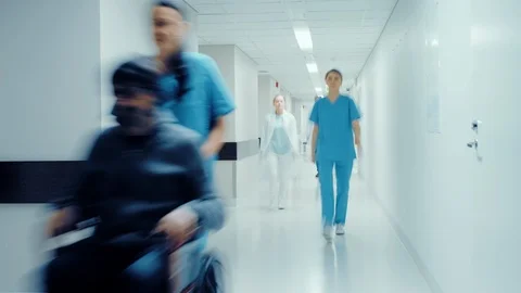 Time-Lapse of the Busy Hospital Corridor: Doctors, Nurses, Surgeons and Patients Stock Footage