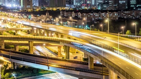 Time lapse of the busy interchange traffic at night in city Stock Footage 74452771
