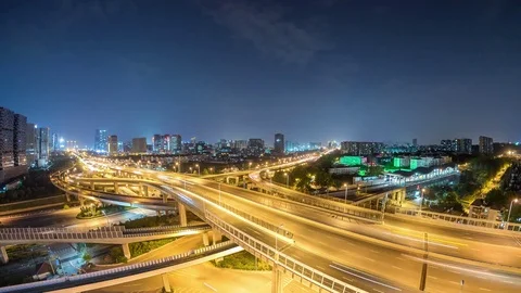 Time lapse of the busy interchange traffic at night in city Stock-Footage 74454077