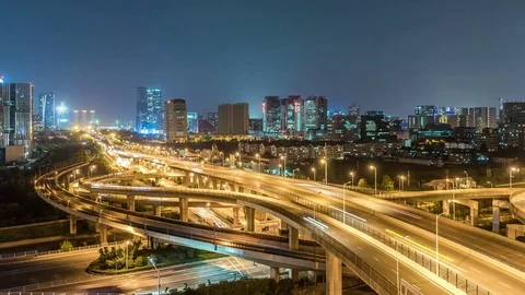 Time lapse of the busy interchange traffic at night in city Видео 74455044