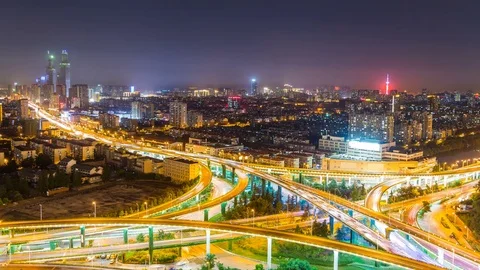 Time lapse of the busy interchange traffic at night in city Stock-Footage 77918744