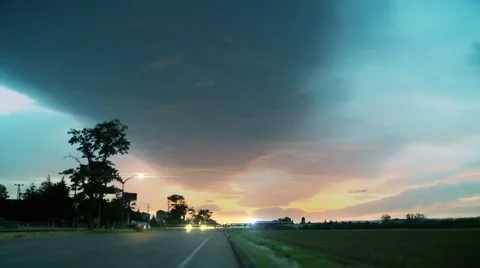 Time-lapse busy traffic and storm clouds in blue sky. Stock Footage 3161769