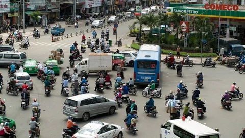 Time Lapse - Busy Traffic Circle  Daytime - Ho Chi Minh City Vietnam Stock Footage 87146813