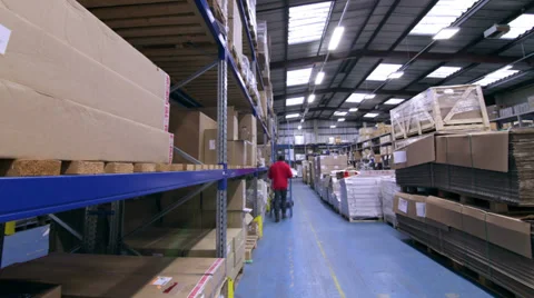 Time lapse of busy workers in a warehouse or factory Видео 32934324