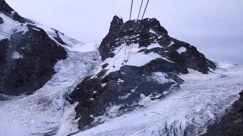 Time-lapse of cable car in snow-capped mountain against sky Stock Footage 120427801