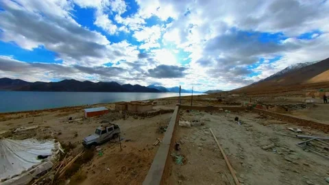 Time lapse of Captivating Clouds over Pangong Lake with Sun Rays and Mountain Ra Video stock 237985568
