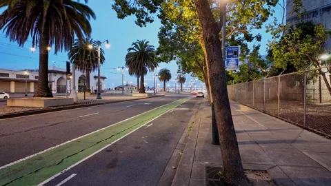 Time-lapse captures a continuous flow of activity as vehicles and pedestrians Vídeos de archivo 311806152