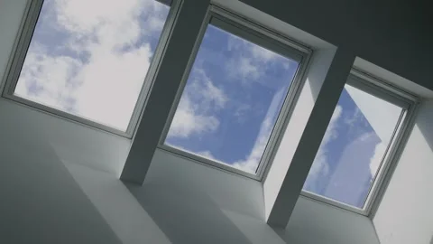 Time-lapse capturing the movement of clouds through a cluster of roof windows Vídeos de archivo 286258588