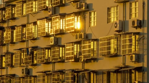 Time-lapse capturing sunset light sweeping over residential buildings. Stock Footage 340317605