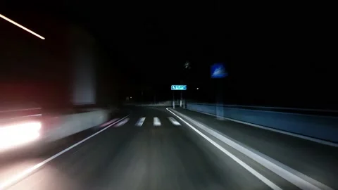 Time lapse: the car drives along the highway at night Stock Footage 148764942