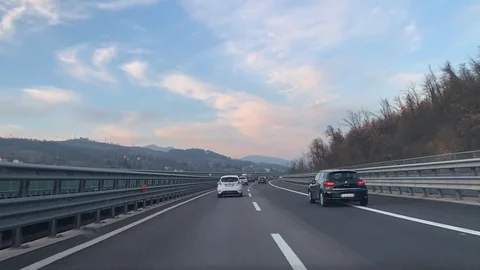 Time lapse of car driving across a highway in Italy passing through tunnels Stock Footage 122528355