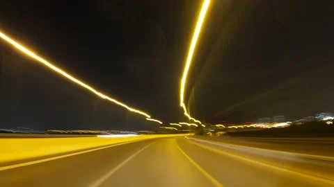 Time lapse of a car driving in Night Freeway Stock Footage 136661574
