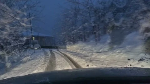 Time lapse car driving on the road in the snow Stock Footage 152486533