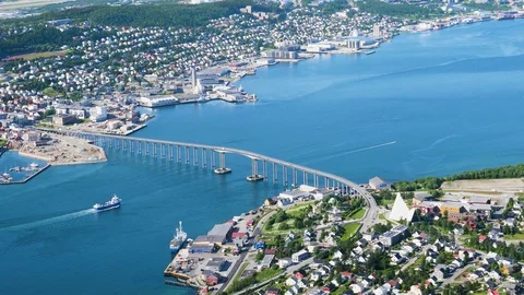 Time lapse of car traffic over Tromso Bridge with ships navigating fjord Stock-Footage 113724816