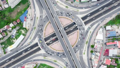 Time-lapse of car traffic transport at roundabout road. Drone aerial top view Stock Footage 131668796