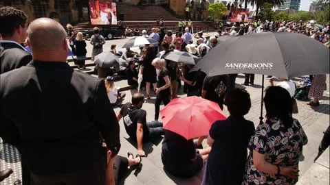 Time lapse Cardinal George Pell funeral crowds outside St Marys Cathedral 4K Stock Footage 232223613