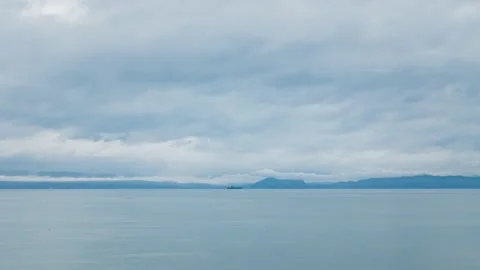 Time lapse of cargo ship and clouds on the BC coastline. 4K 24FPS. Stock Footage 147074503