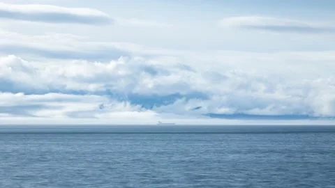 Time lapse of cargo ship and clouds on the BC coastline. 4K 24FPS. Stock Footage 147074681