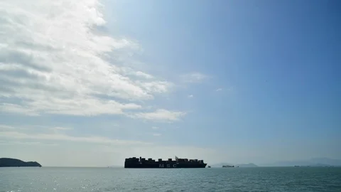 Time lapse of a cargo ship sailing on the sea outside Hong Kong Stock Footage 116711379