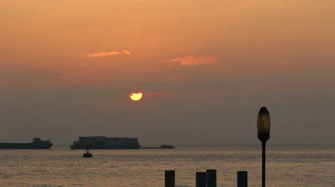 Time lapse: cargo ships driving on the river and sun falling down Stock Footage 46011459