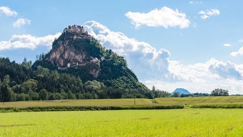 Time Lapse - Castle with a corn field in front and moving clouds above Видео 99362451