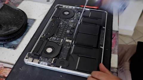 Time lapse: caucasian technician opens and repairs or cleans a laptop. Top view Video stock 135669412