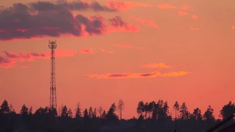 Time lapse of a cell tower silhouette against evening sky Stock Footage 78255355