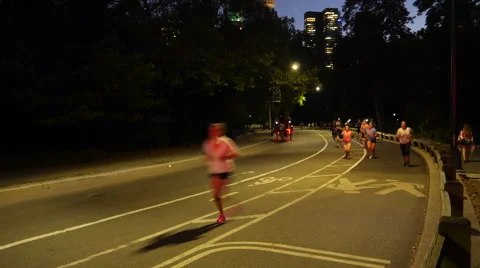 TIME LAPSE CENTRAL PARK JOGGERS CARRIAGES NIGHT-Apple ProRes 422 Stock Footage 41817453