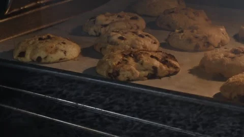 Time lapse of chocolate chip cookies baking in the oven Stock Footage 243422166