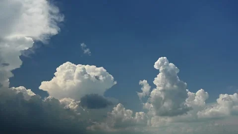 Time lapse of churning and growing storm clouds building in a blue sky. Stock Footage 296657198