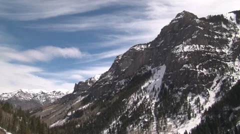 Time lapse of cirrus clouds moving over peaks. Stock Footage 36640328