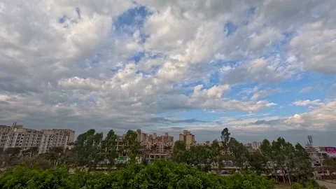 Time lapse of city fast moving traffic blue sky moving clouds Stock Footage 288701387