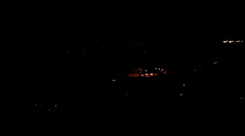 Time lapse: city lights and traffic glowing in the night Stock Footage 34348999