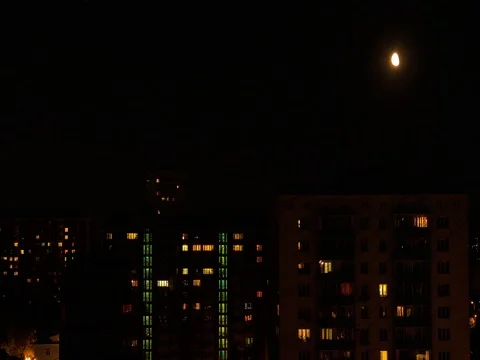 Time Lapse City Lights In Windows whith moon Stock Footage 78730407
