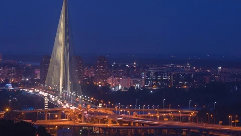 Time lapse of city traffic on the bridge at night	 Stock Footage 127813102