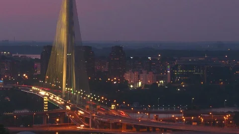 Time lapse of city traffic on the bridge at night	 Stock Footage 127827434