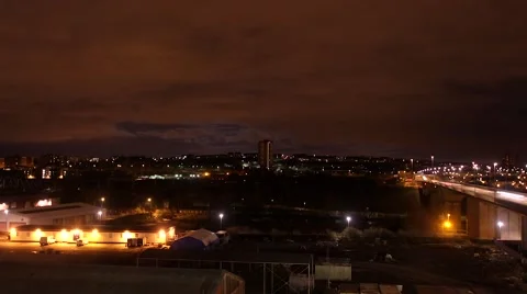 Time lapse of city train and traffic over city bridge at night Stock Footage 41234739
