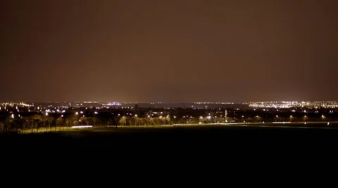 Time lapse of cityscape sity scape at night with traffic and planes landing Stock Footage 41234420