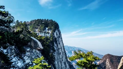 Time Lapse of Clear Blue Sky Solitary Cliff Ancient Pine Distant Peak Thin Mist Stock Footage 337938238