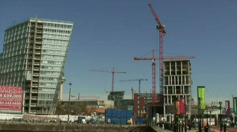 Time-lapse clip of 6 large tower cranes, cars  and people. HD 1080i Stock Footage 115068